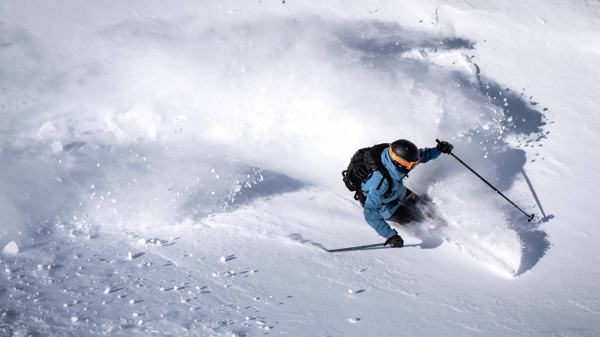 Skier slashing deep snow at Brighton Ski Resort