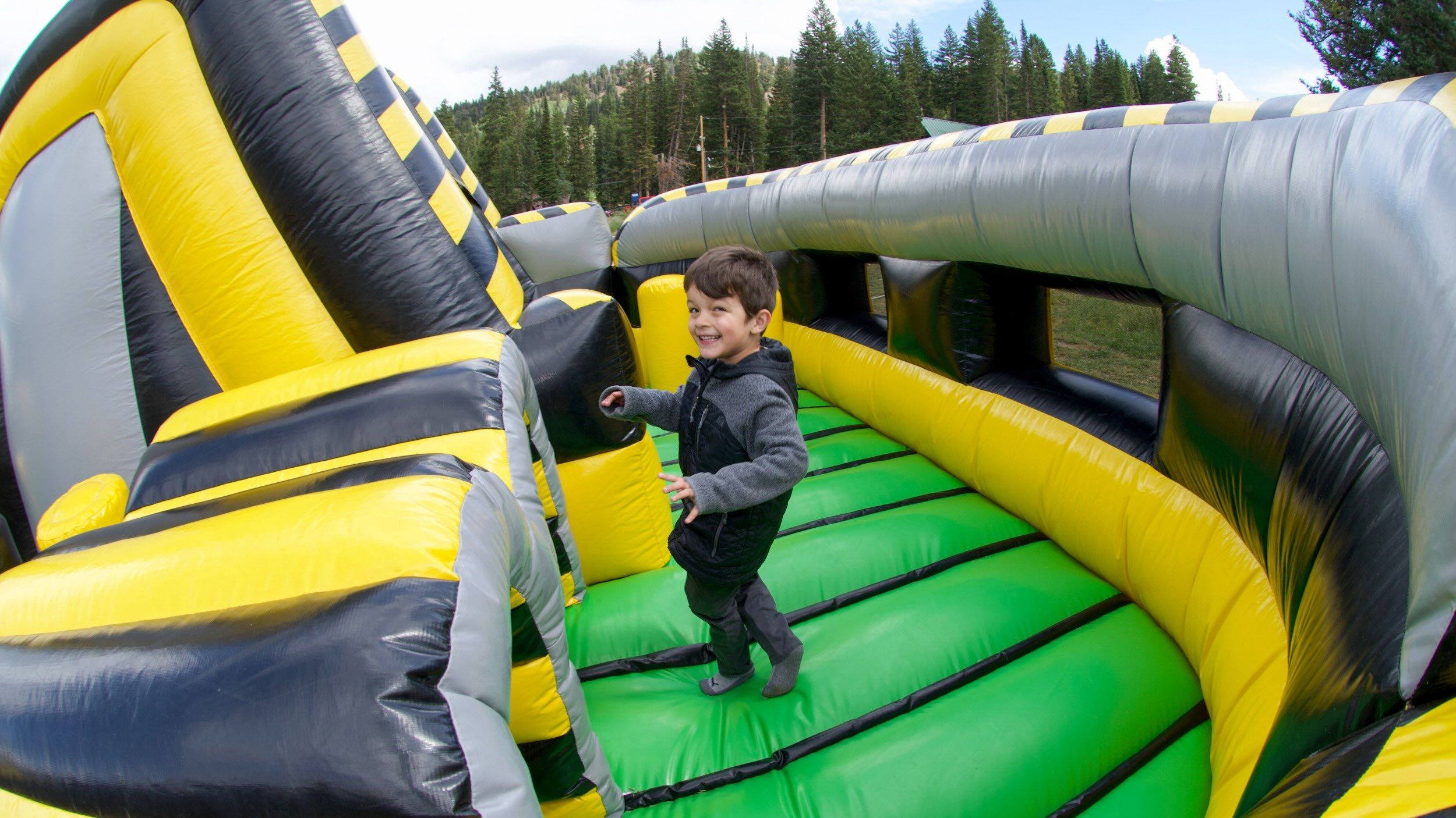 Kid playing in the fun houses at Brighton Resort in the summer