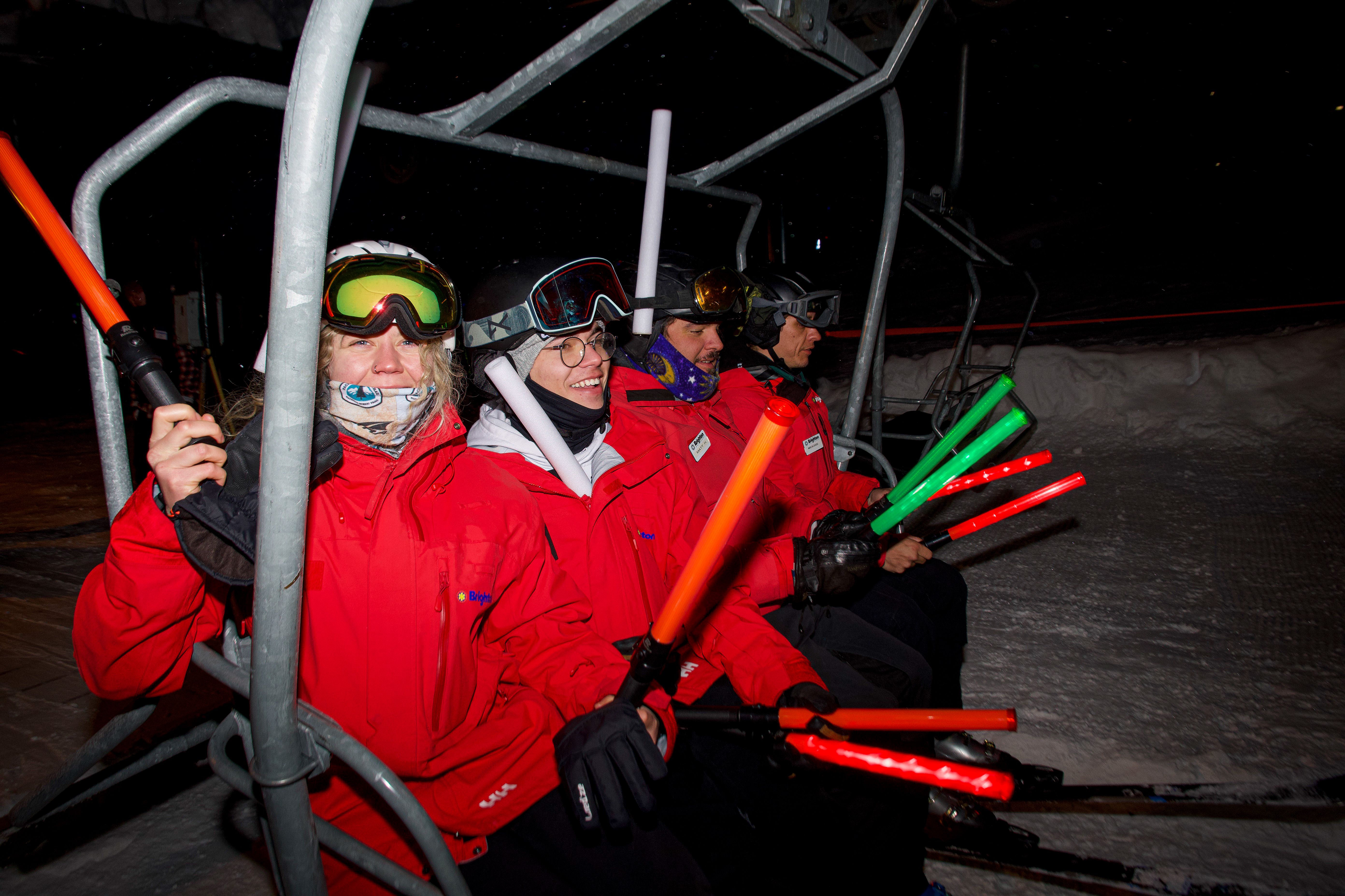 Brighton Ski School instructors celebrating on the chairlift