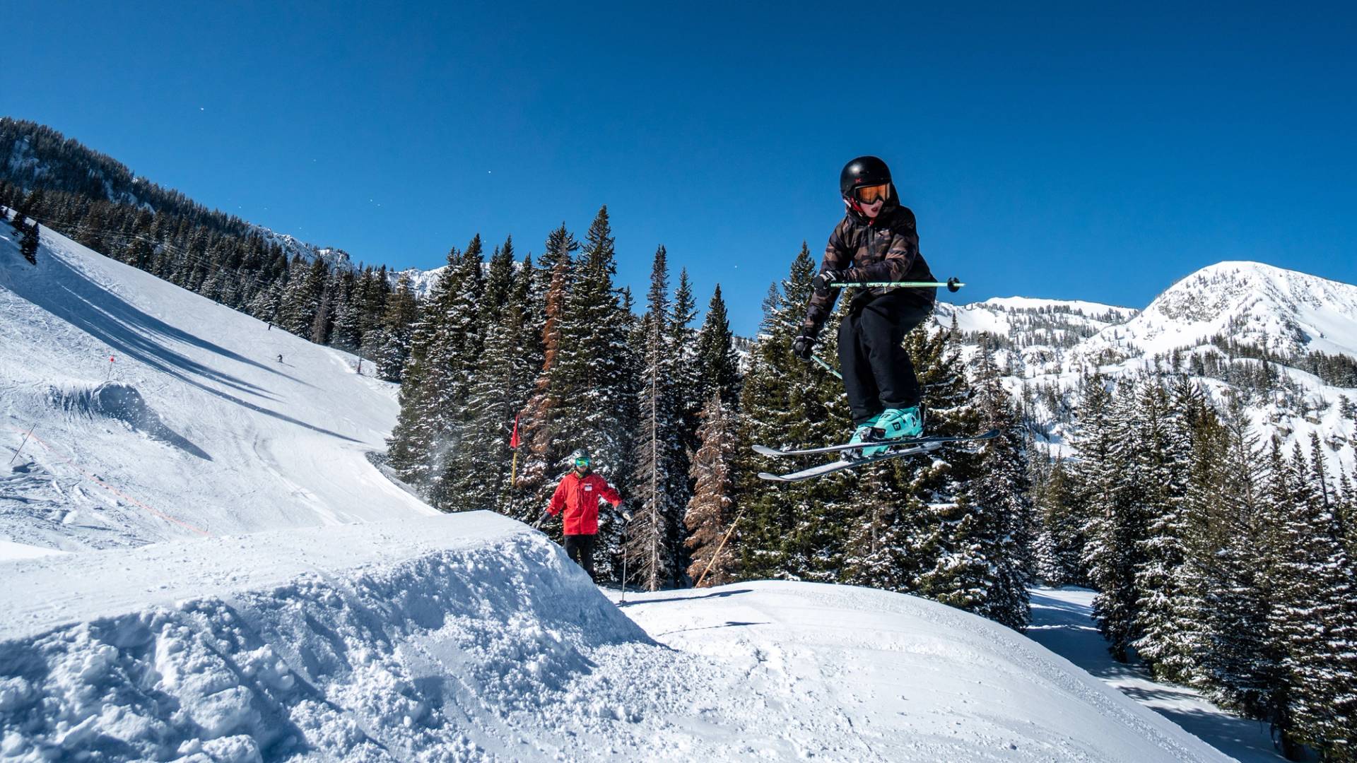 Kid jumping in Majestic terrain park at Brighton Ski Resort