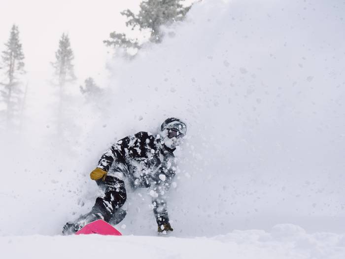Snowboarder in deep powder