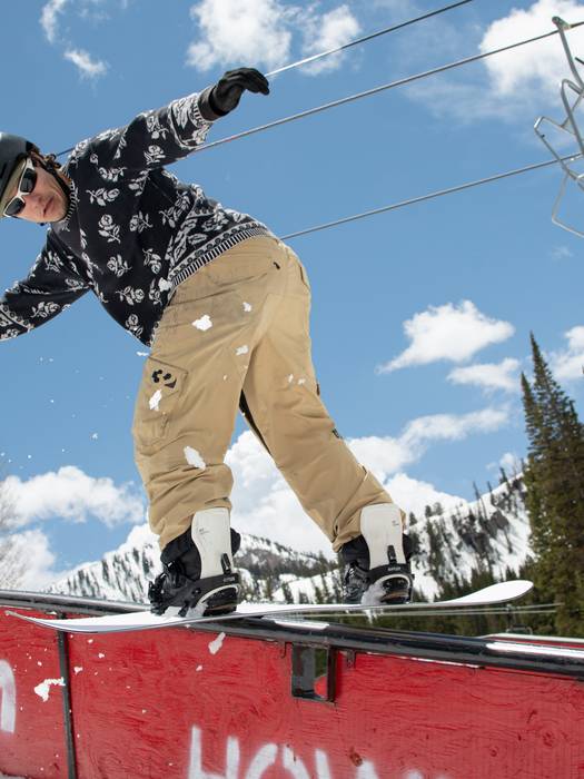 Snowboarder hitting a rail at The Meltdown