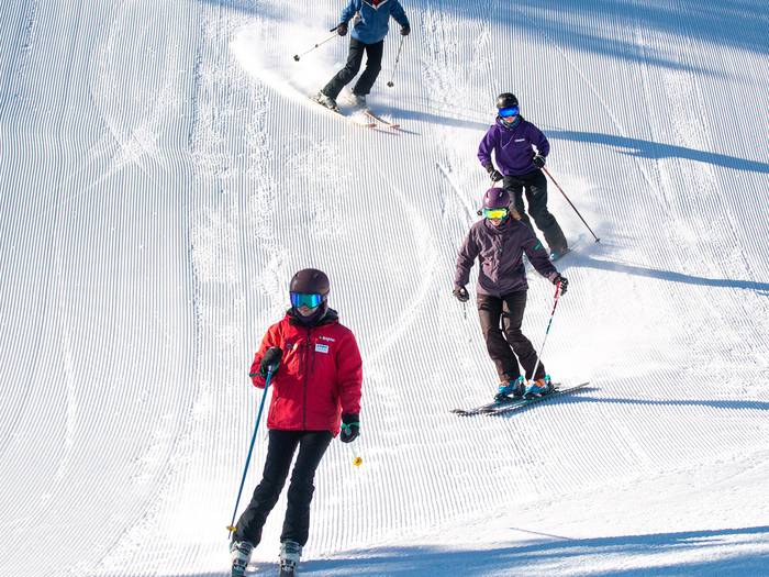 Ski lesson on a groomer