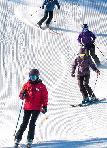 Brighton ski school instructor during adult group lesson