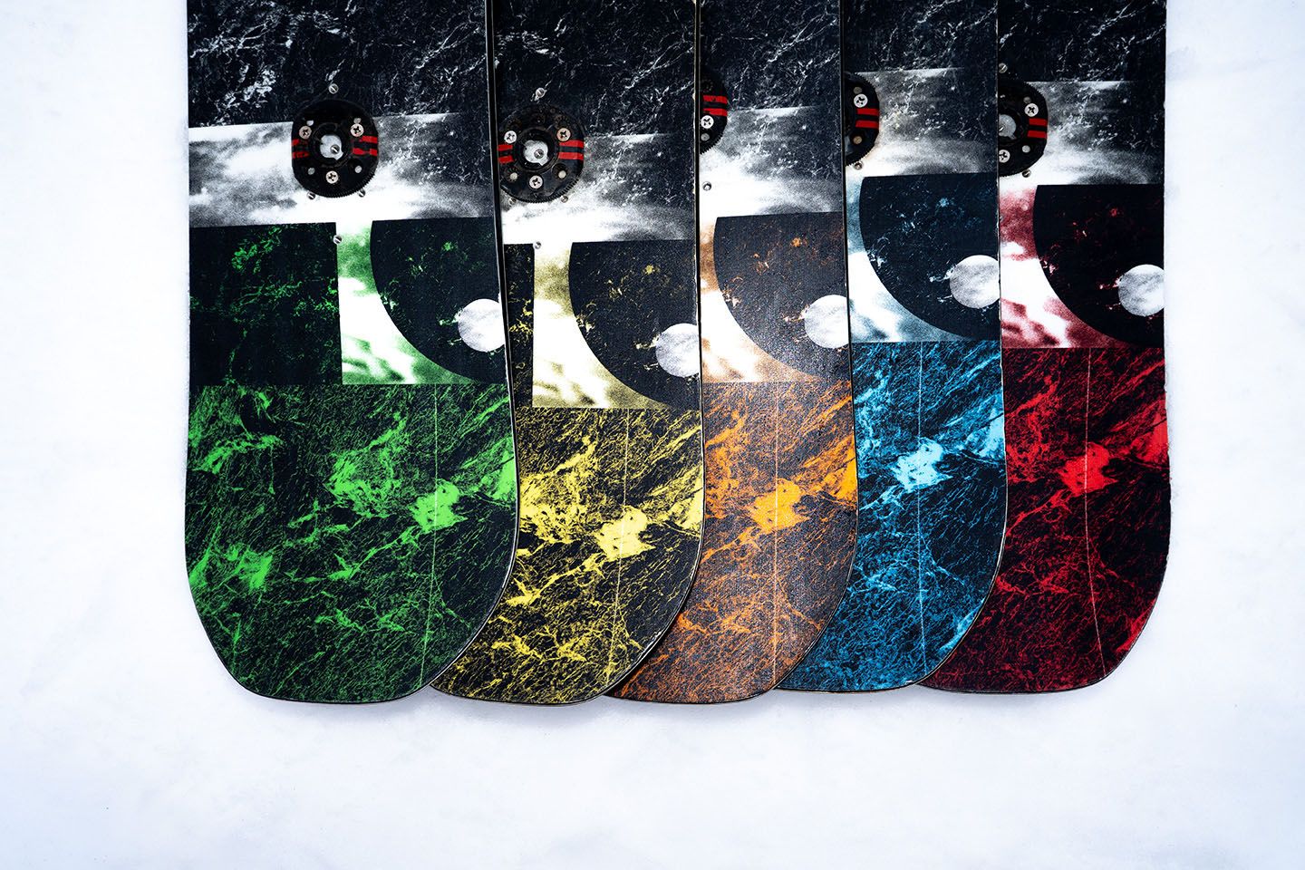 Rental boards laid out on snow.