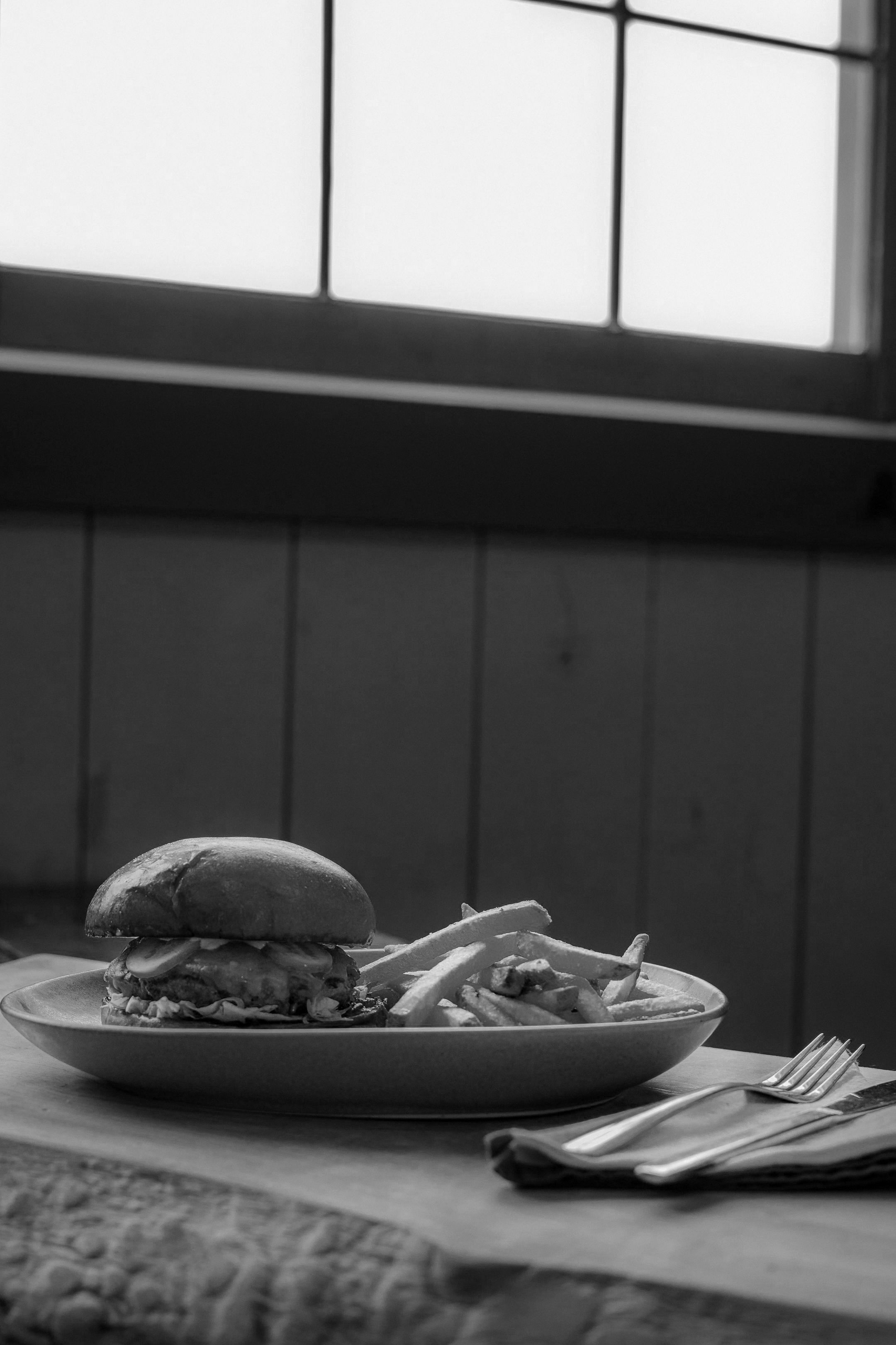 cheese burger with pickle lettuce and coleslaw served with fries at Hollyburn Lodge