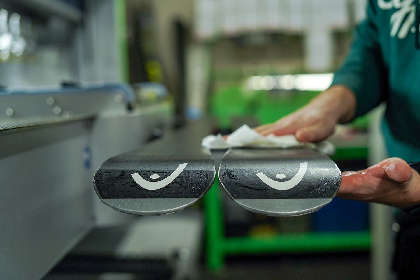 rental employee waxing and tuning Atomic skis.