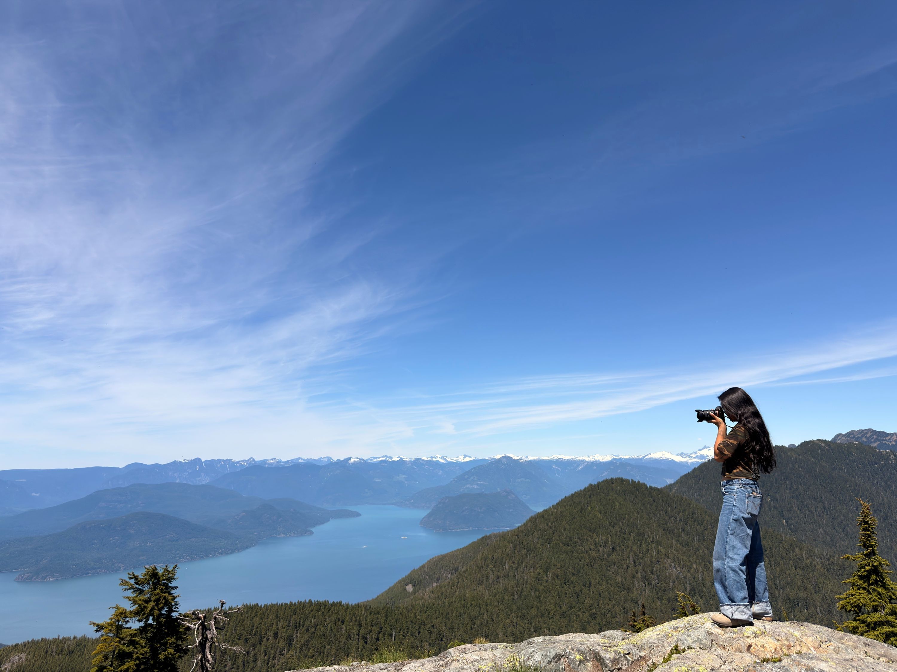 person taking photo of howe sound
