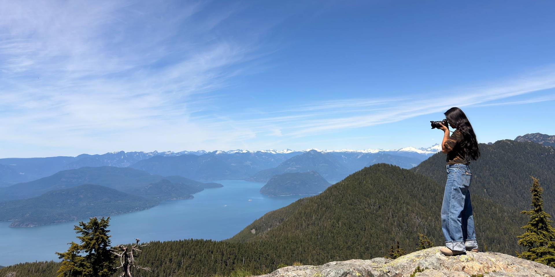 person taking photo of howe sound
