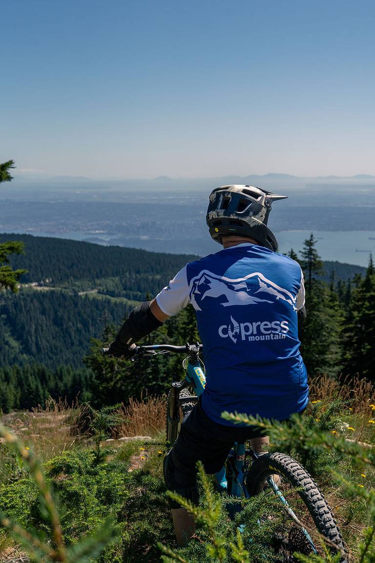 Mountain biker looking at the views over Cypress Mountain.