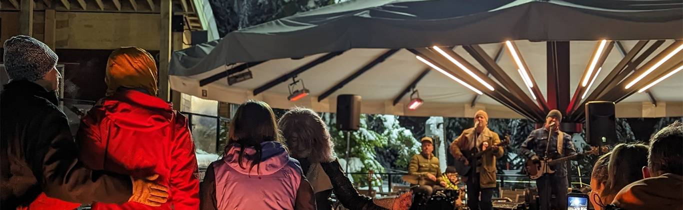 A live band performs to a crowd of people at Cypress Mountain's Apres Ski Patio