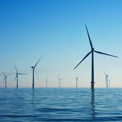Wind turbines in water.