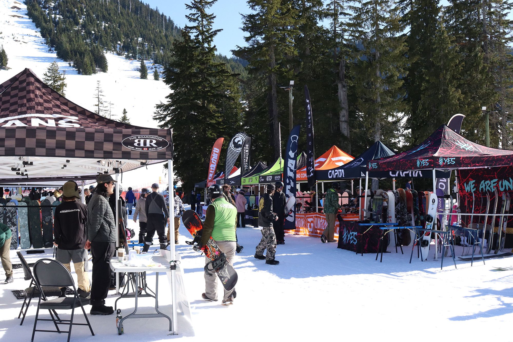 Artist performing live music in the mountains on a patio during the summer.