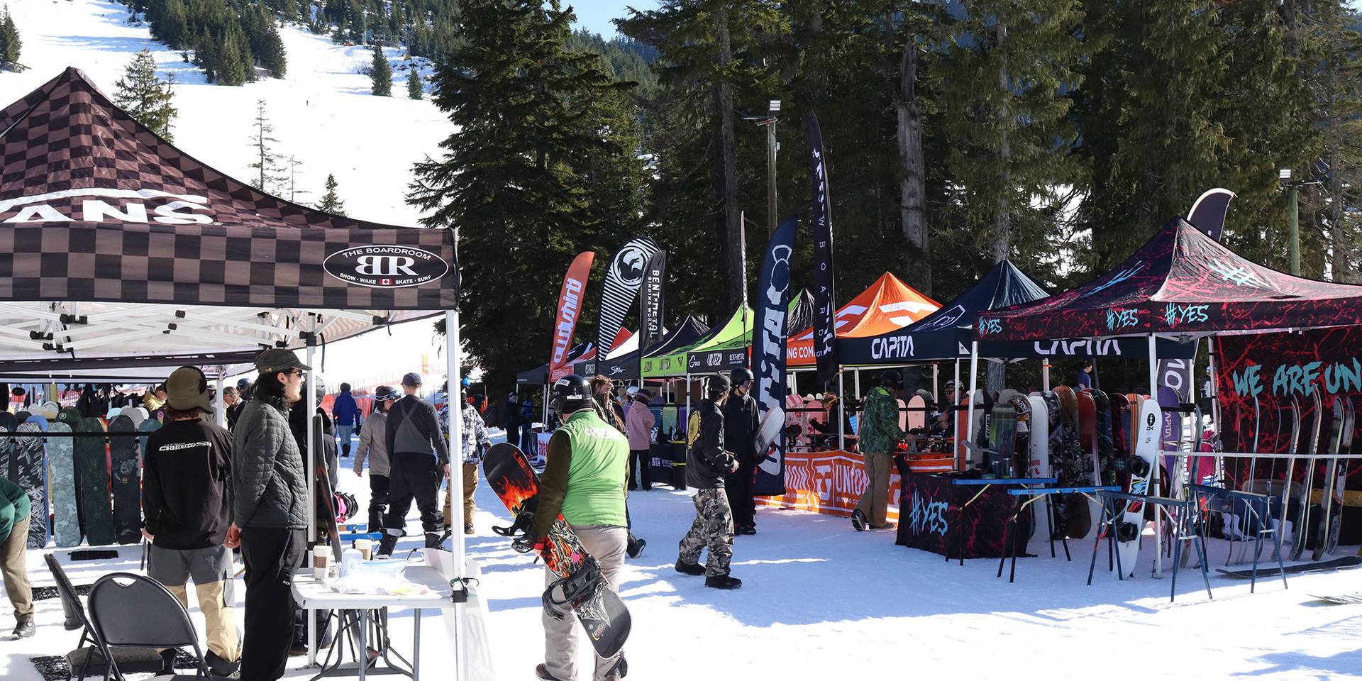 Artist performing live music in the mountains on a patio during the summer.