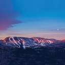 An aerial view of a ski resort at sunset.