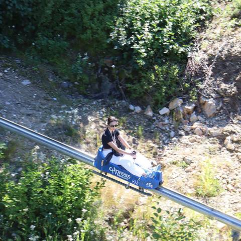 Aerial shot of a woman riding the Eagle Coaster.