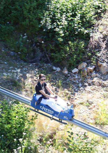 Aerial shot of a woman riding the Eagle Coaster.