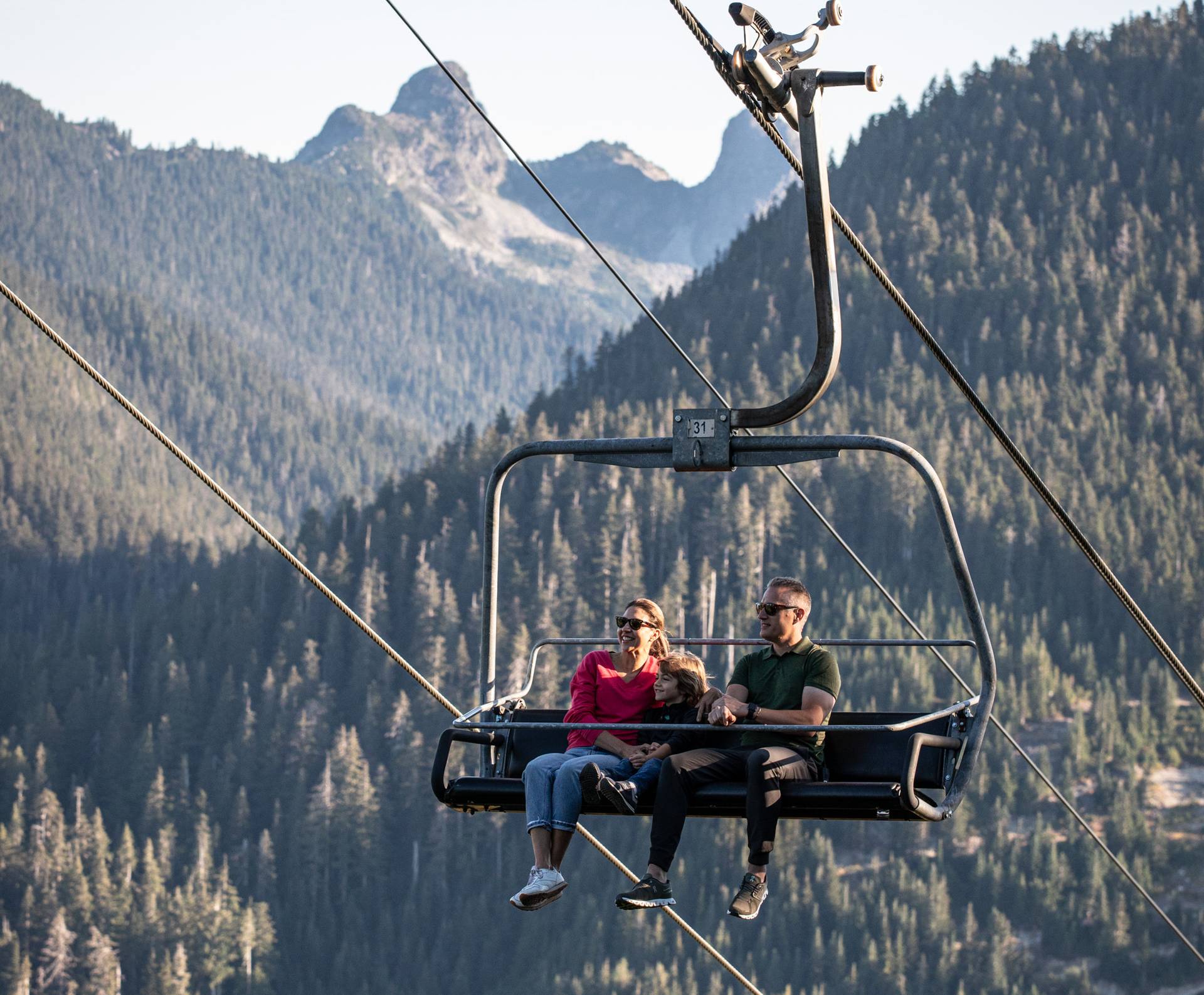 A family on a scenic chairlift ride.