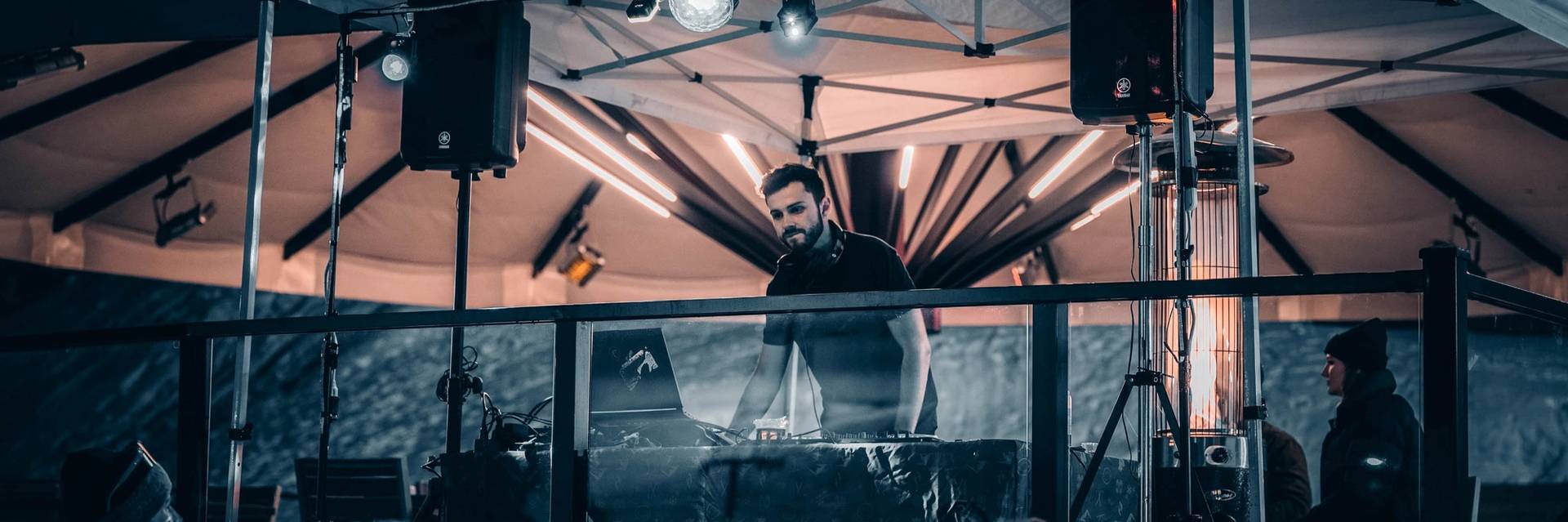 DJ performing on the patio for an apres event.