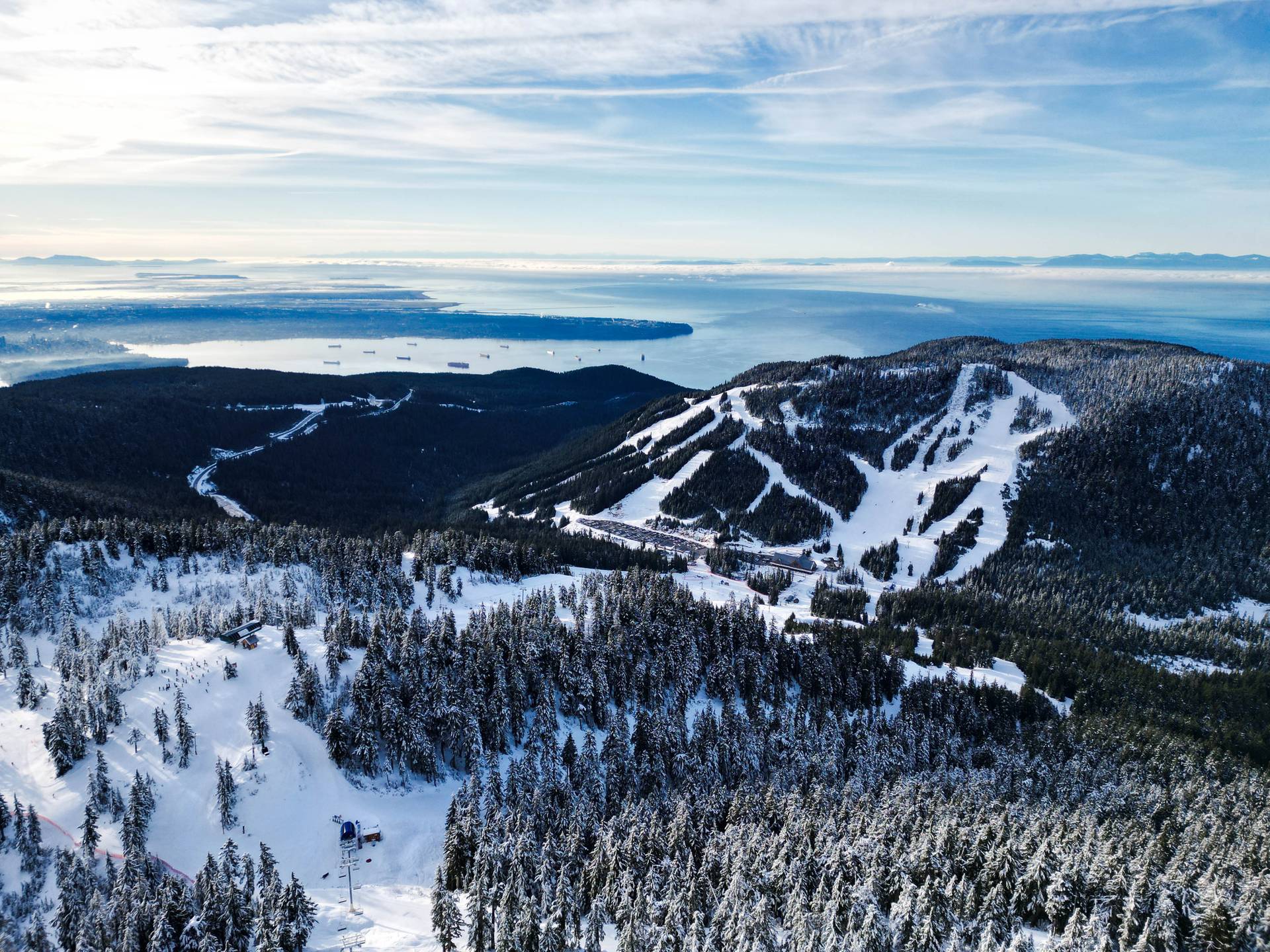 snowy chairlift up to the peak