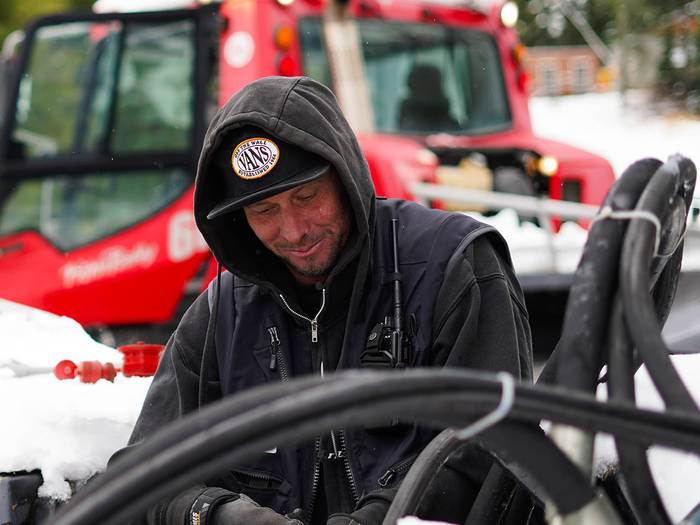 Cypress employee working on snowcat maintenance.