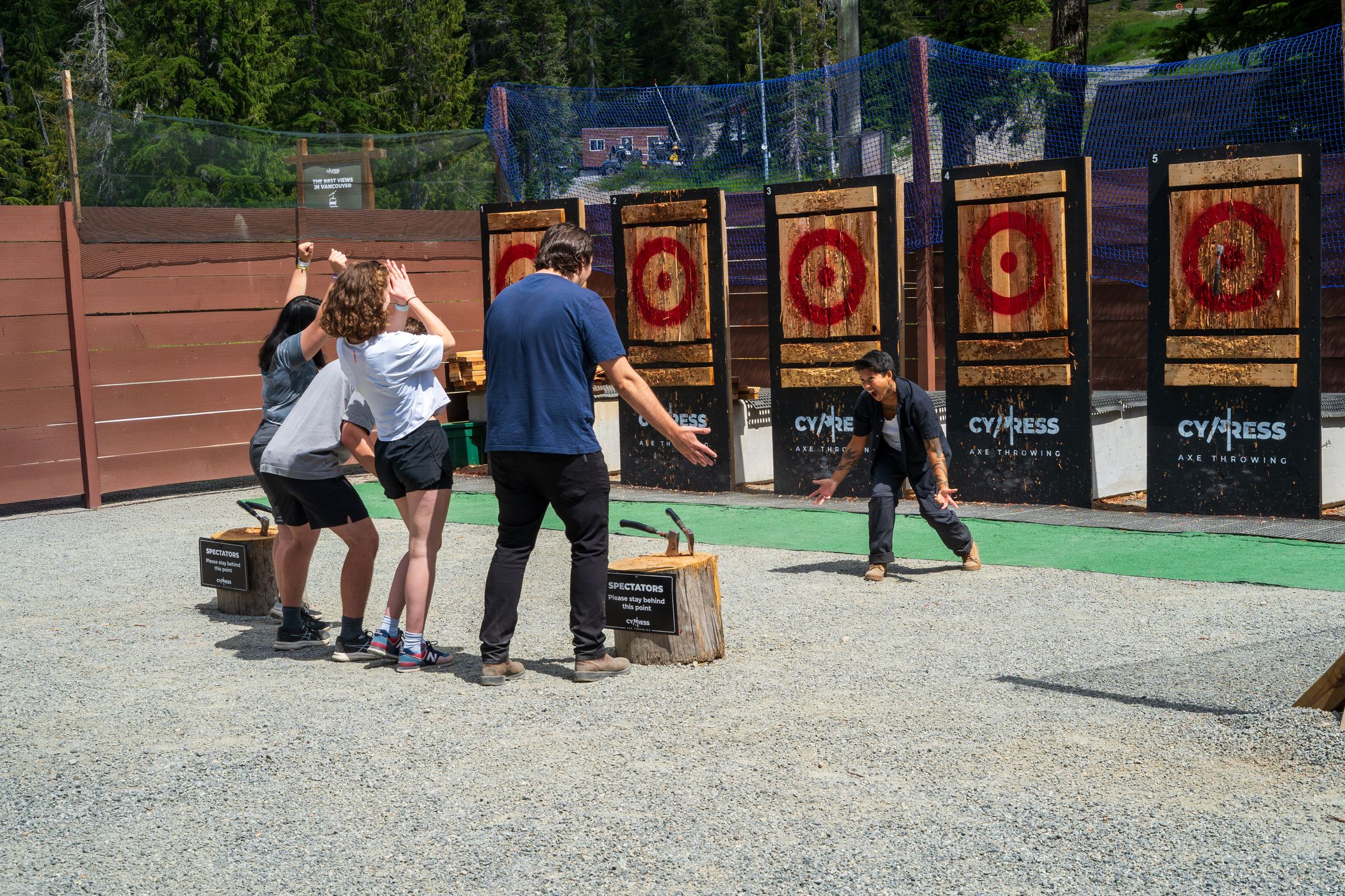 friends celebrating axe throw