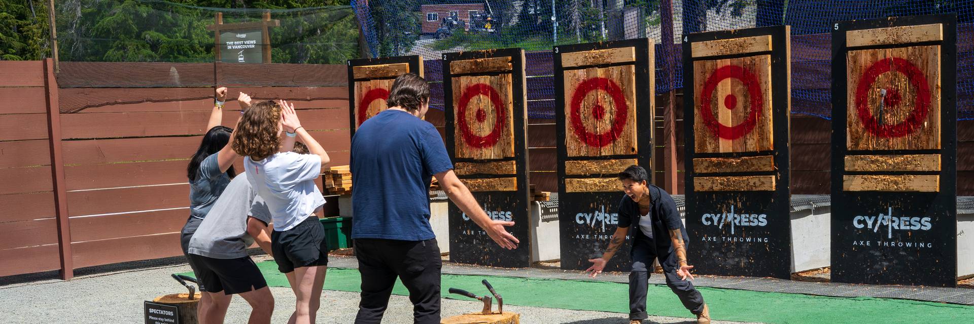 friends celebrating axe throw