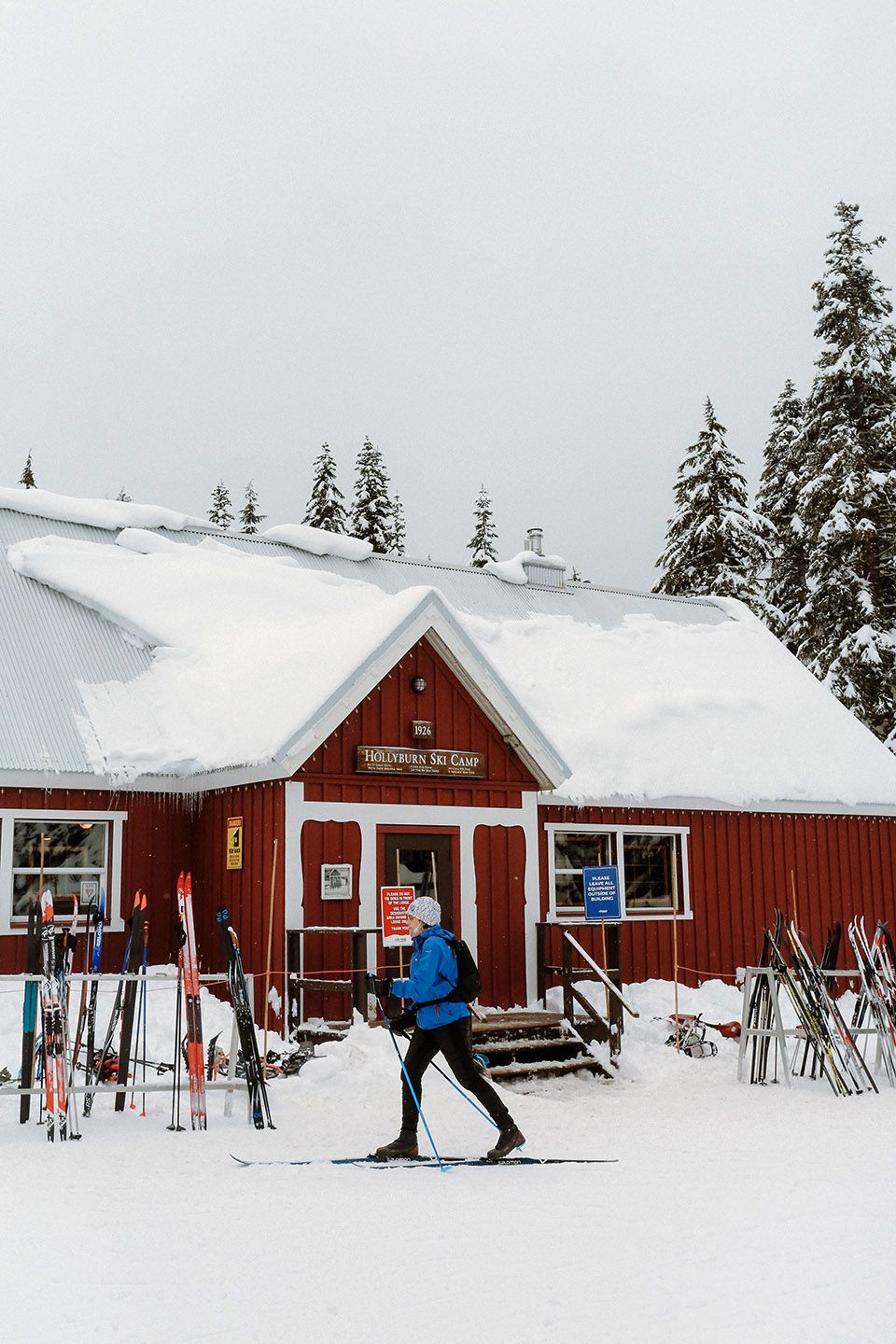 Cross country skier in front of Hollyburn Lodge.