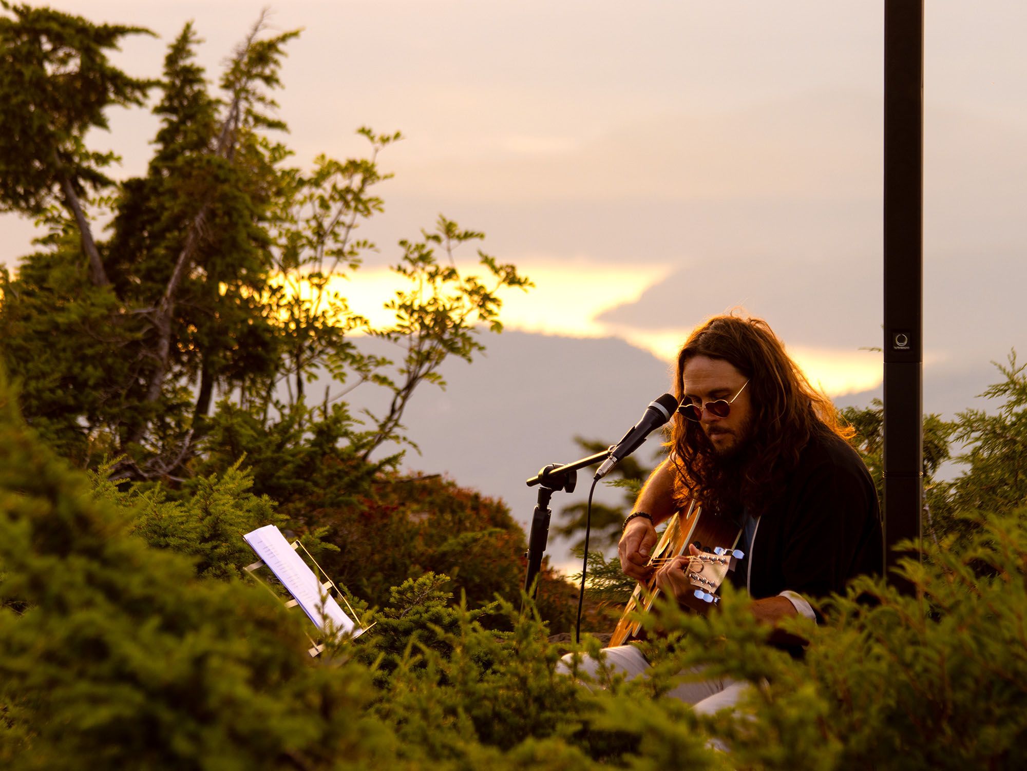 musician top of sky sunset