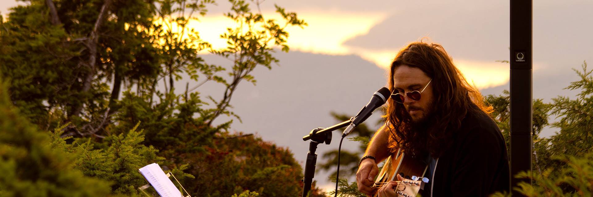 musician top of sky sunset