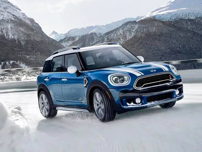 A Mini Cooper on snow.
