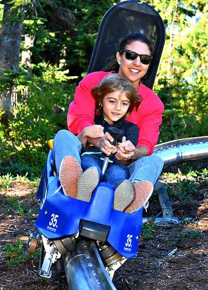A mother and son riding the Eagle Coaster.