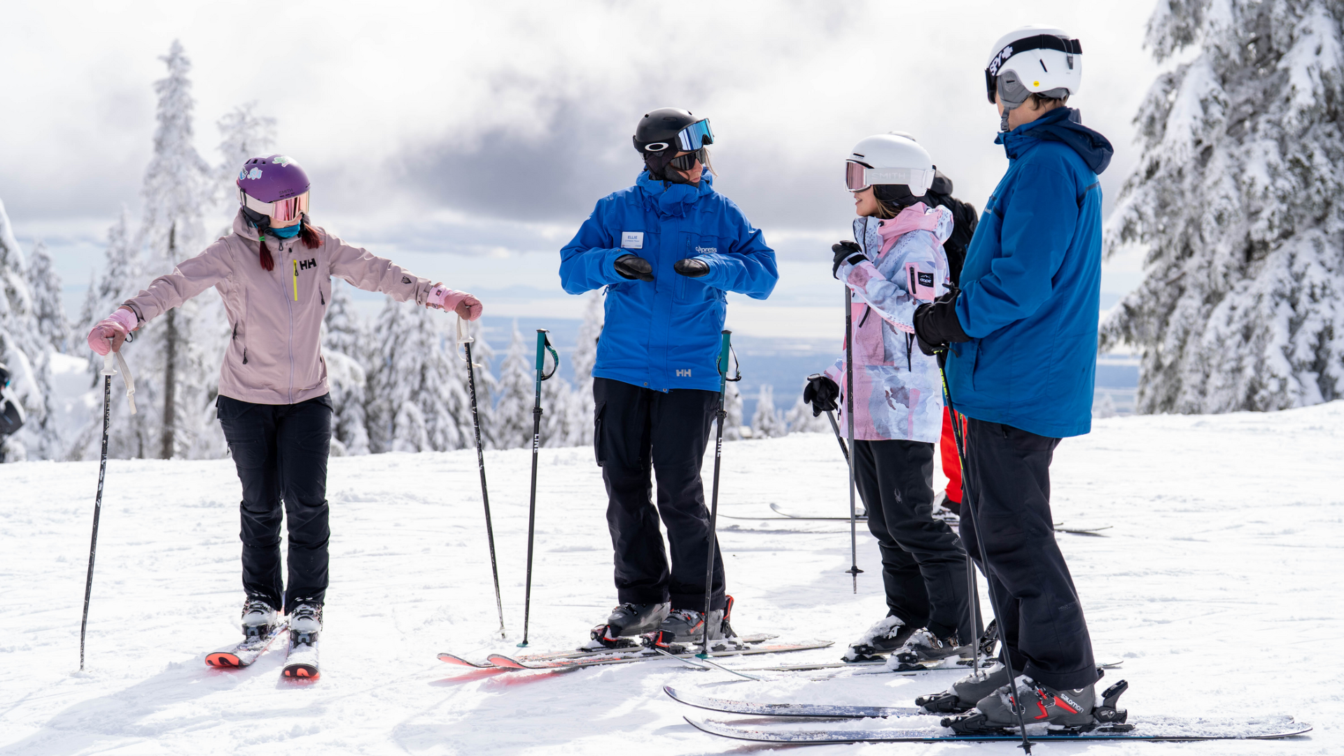 Instructor teaching a group of skiers