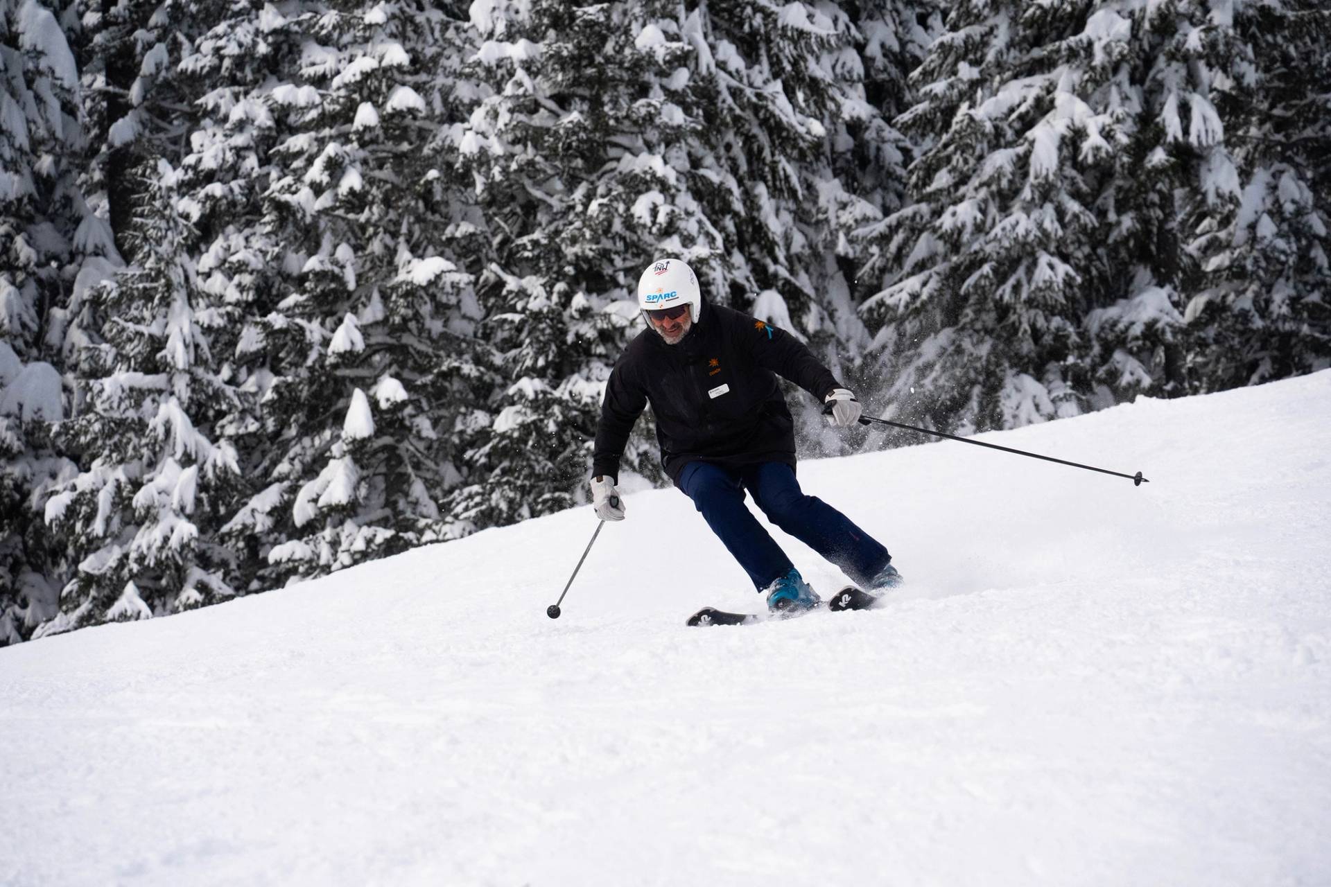 sparc master skier on groomer