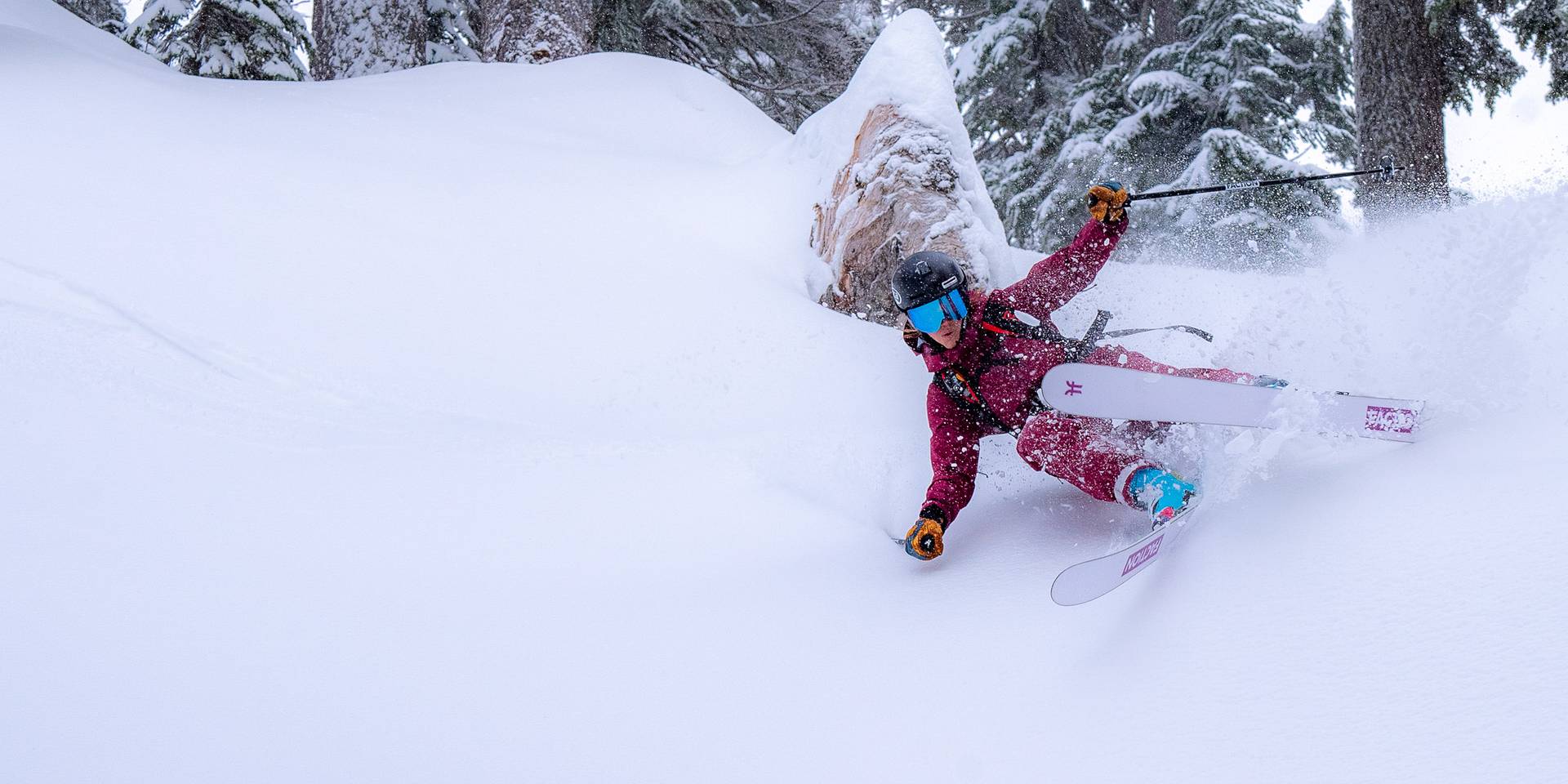 skier turning in deep pow
