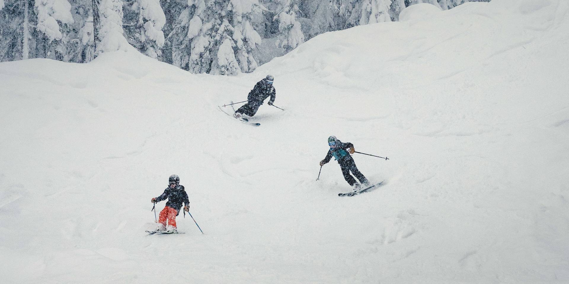snowboarders smiling on a mystical foggy morning