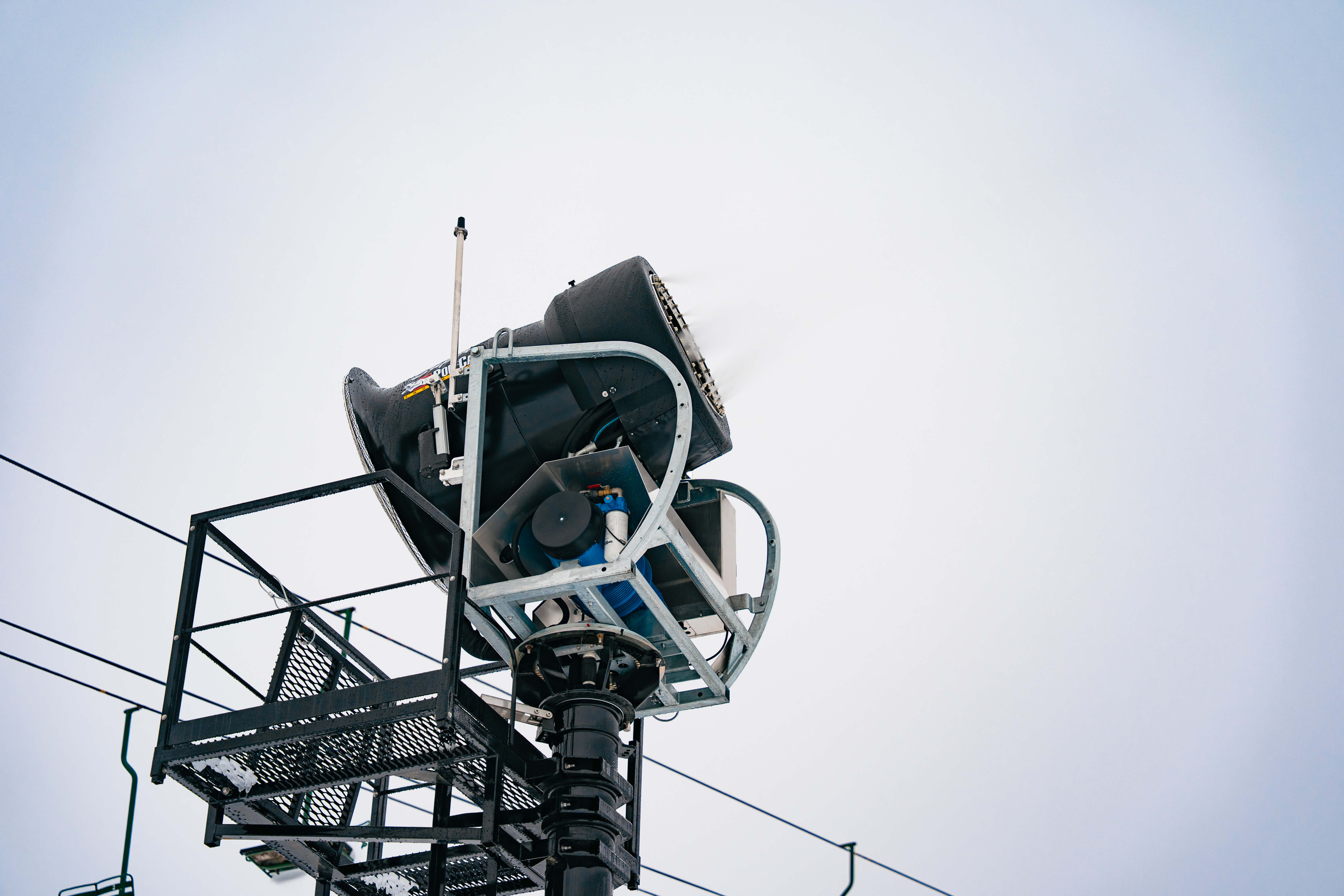 A close up view of a snow gun at Summit West