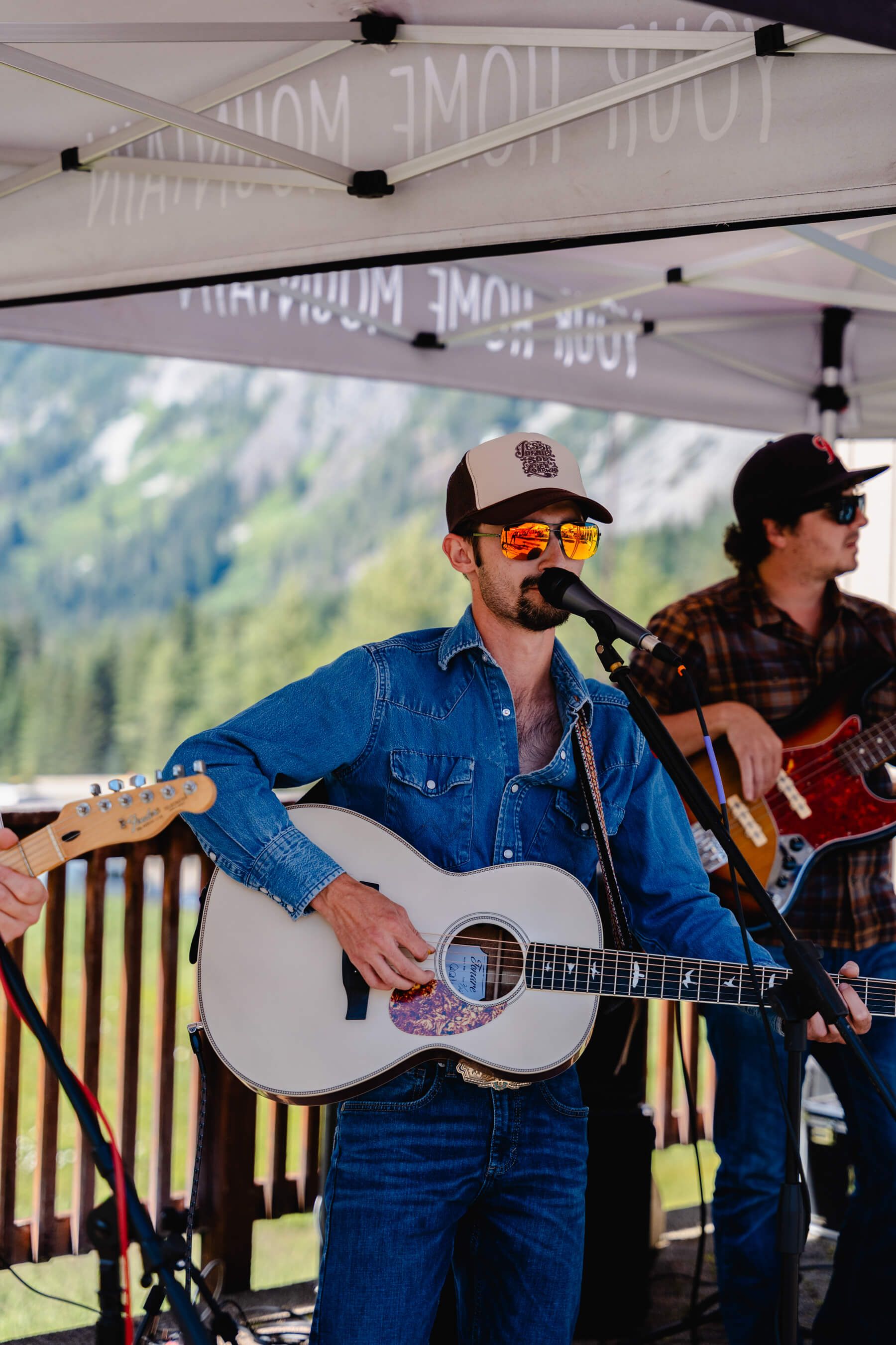 cody bartels with guitar and cowboy hat at summit west