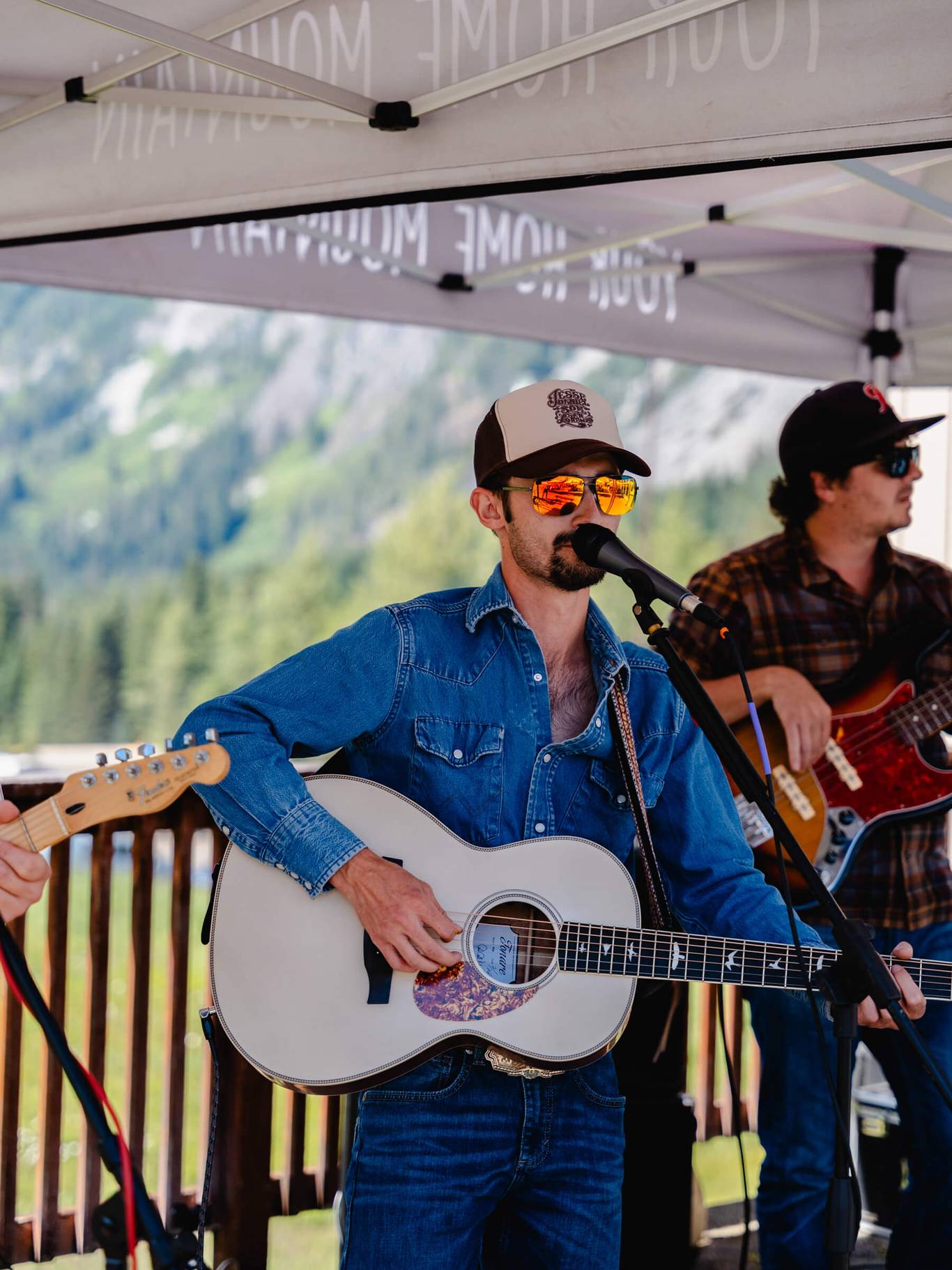 cody bartels with guitar and cowboy hat at summit west