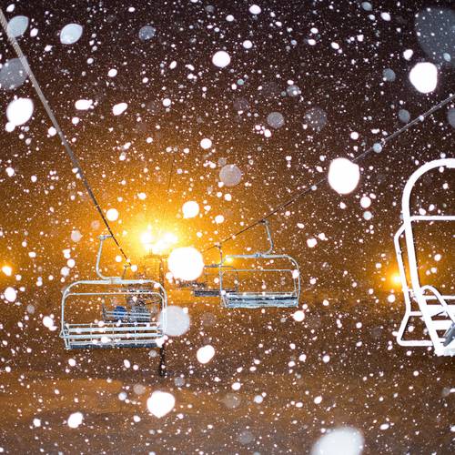 Snowing at night on a chairlift