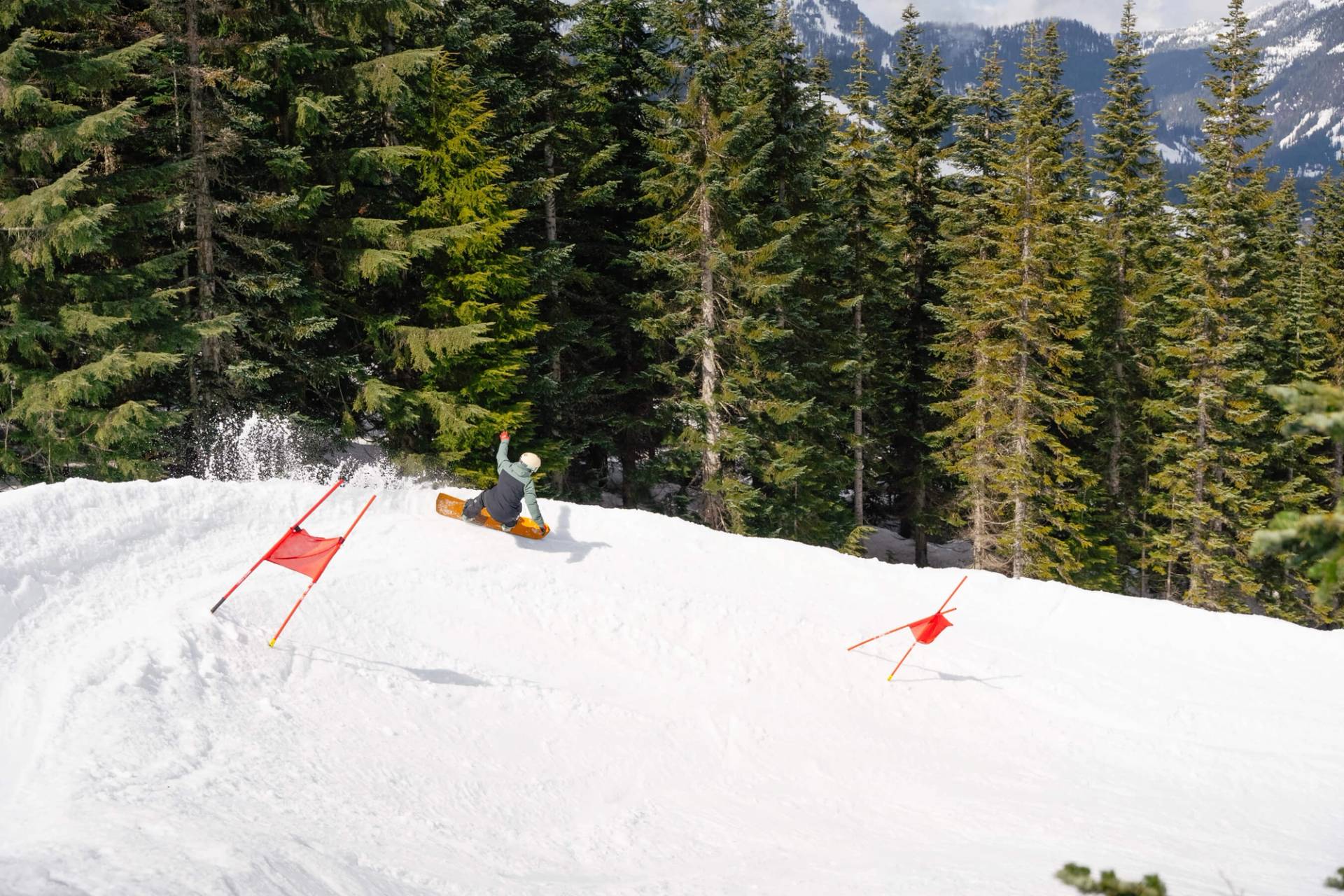 snowboarder flies through banked slalom turn