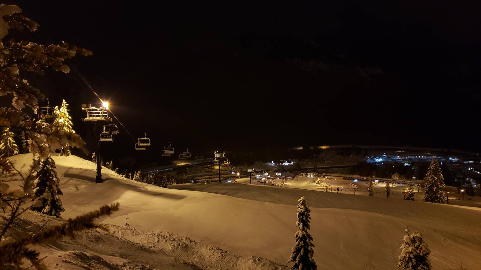 view of Summit West from top of hill at night