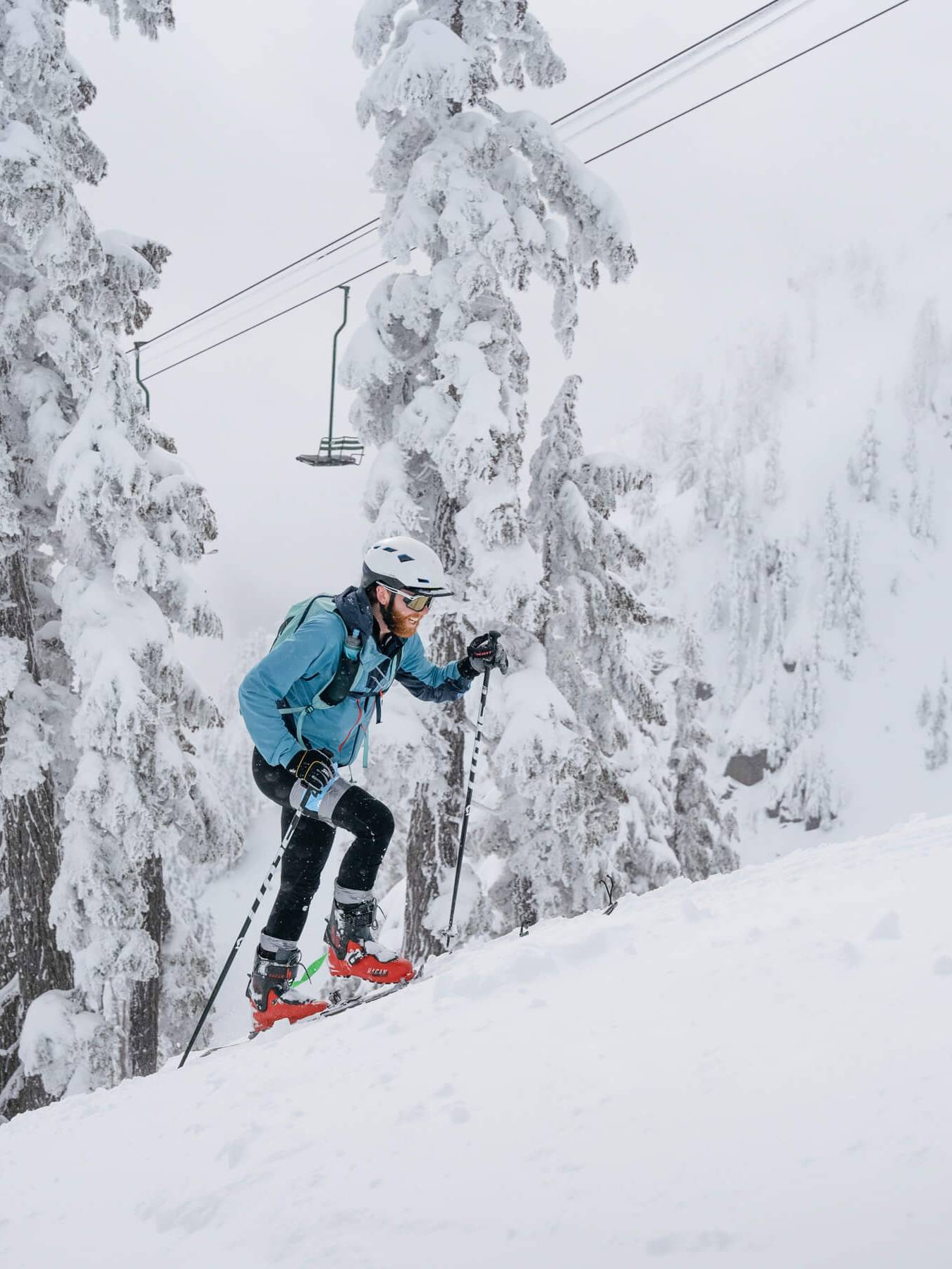 Vertfest competitor climbs uphill under chair 2 alpental