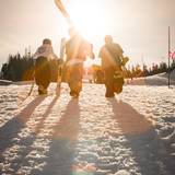 skiers hiking the competition venue