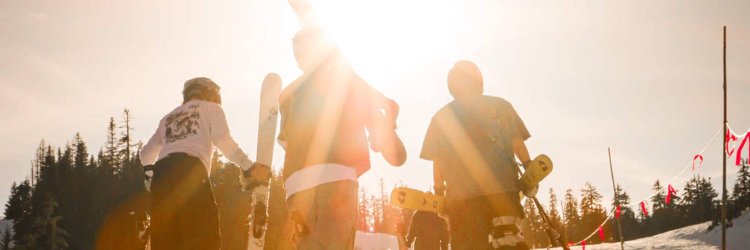 skiers hiking the competition venue