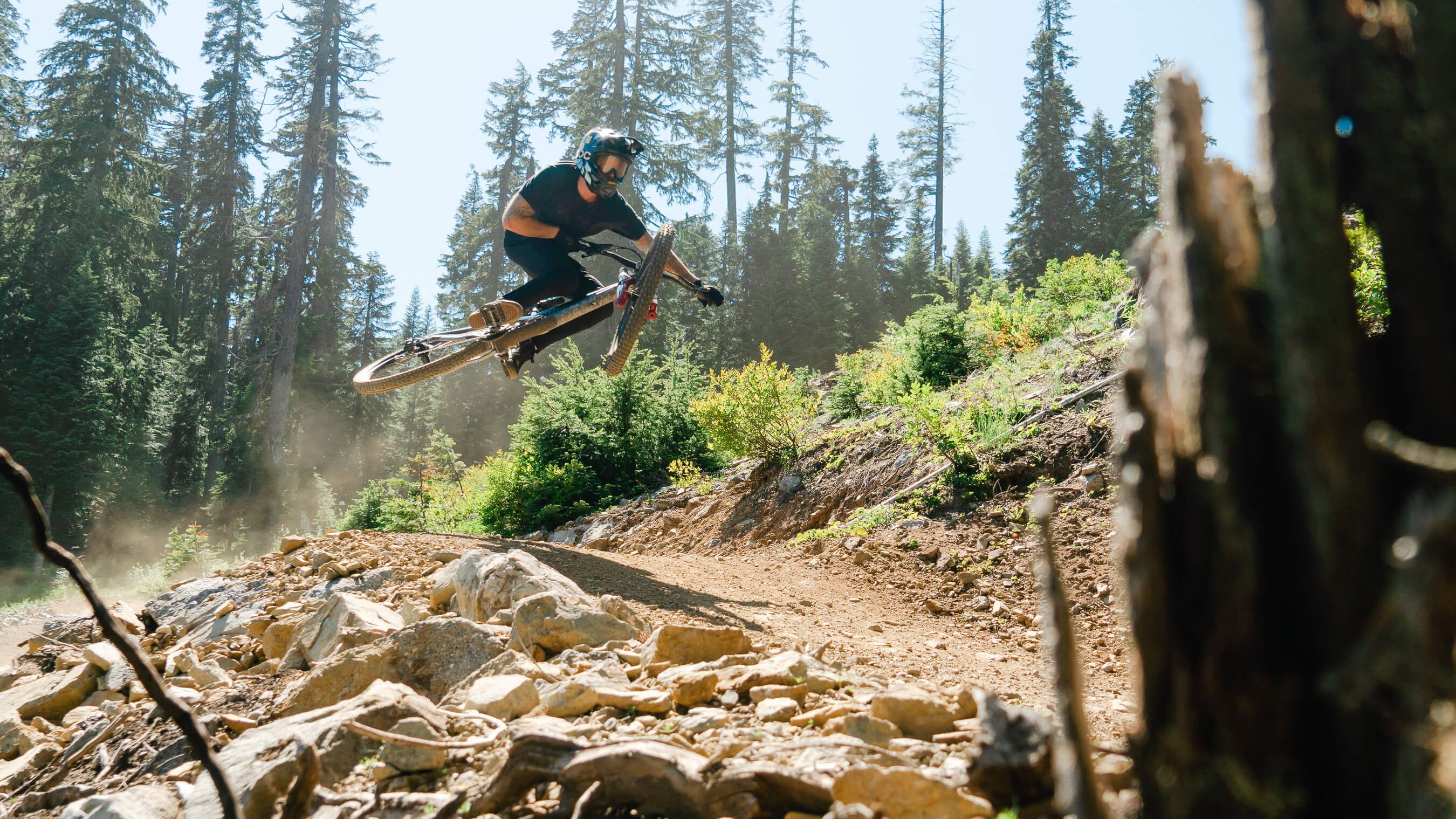 mountain biker airing a jump
