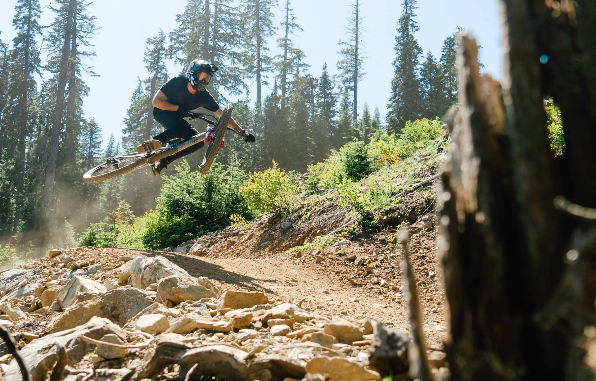 mountain biker airing a jump