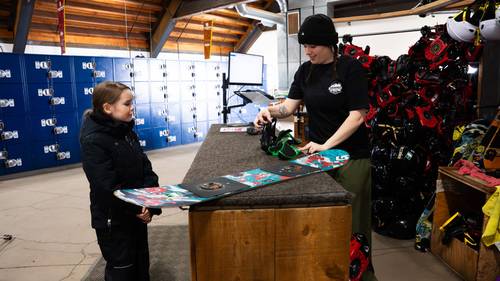 rental tech with a guest in the rental shop