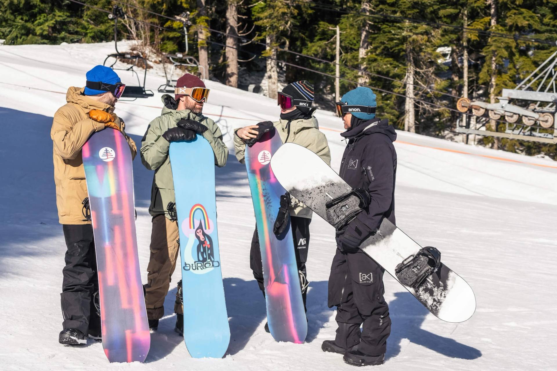 group of snowboarders at base of silver fir