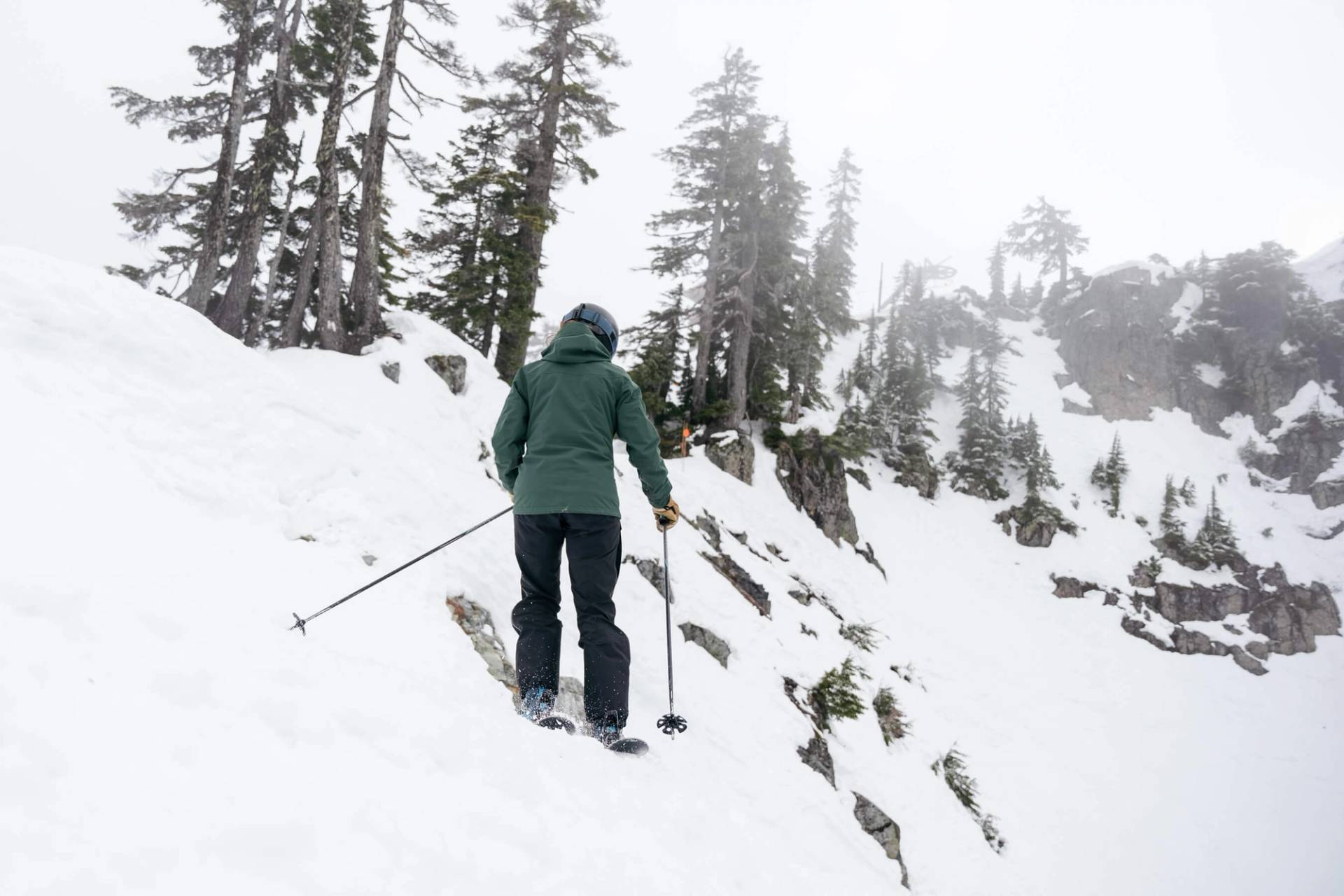 skier checking out her line